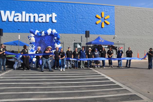 Walmart’s longtime staff members cut a ribbon for the grand reopening of the Stephenville location. Wyndi Veigel- Gaudette | Citizen staff photo