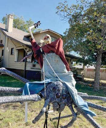 Ridem’ cowboy! A scarecrow skelton rides a spider made by Ori-