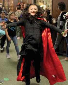 A vampiress ‘flies’ through the air at the annual Spook Parade Friday, Oct. 28 inside Dublin Elementary School. The parade was moved indoors due to the weather. Wyndi Veigel | Citizen staff photo