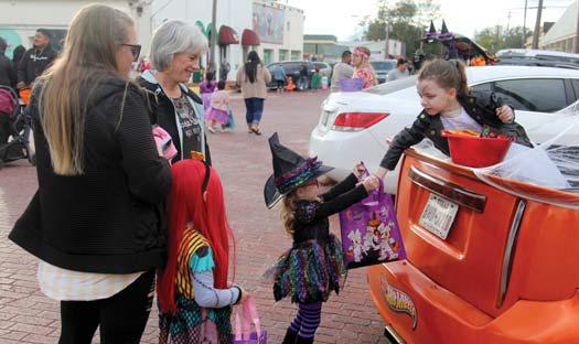 Eager trick-or-treaters enjoy their first chance over the Halloween weekend to get candy at the Stephenville Area Elk’s Lodge Trunk-or-Treat event Saturday, Oct. 29. Wyndi Veigel | Citizen staff photo