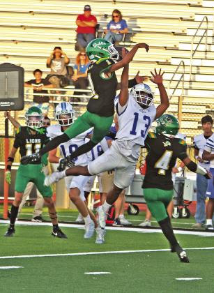 Dublin Lion Kyler Gaitan leaps over a Keene receiver to block a pass in the Friday, Sept. 11 homecoming victory for the Pride. Paul Gaudette | Citizen staff photo