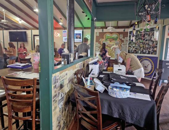 Revitalize Dublin supporters gather inside Shenanigans Irish Pub to bid on silent auction items that aid the nonprofit during the year, including community improvement grants. Wyndi Veigel-Gaudette | Citizen staff photo