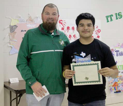 Extracurricular Scholar David Nava. Presented by Band Director Ronny Luedke.