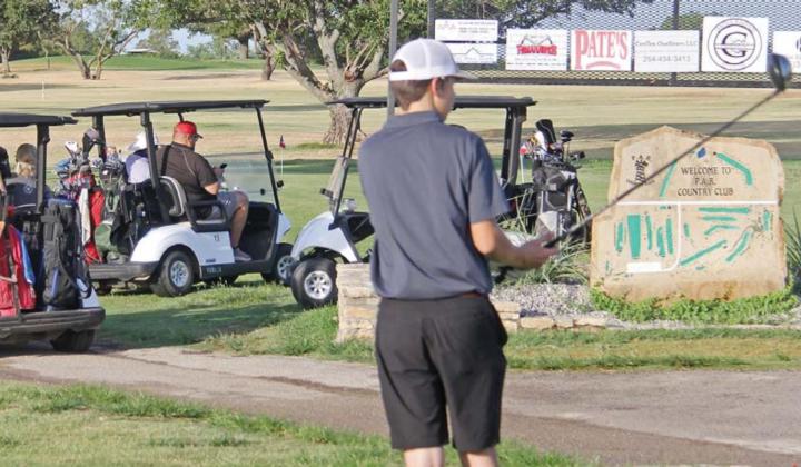 Golfers lined up by the PAR Country Club driving range before teeing off in the annual Dublin Athletic Booster Club golf scramble Saturday morning. Paul Gaudette | Citizen staff photos