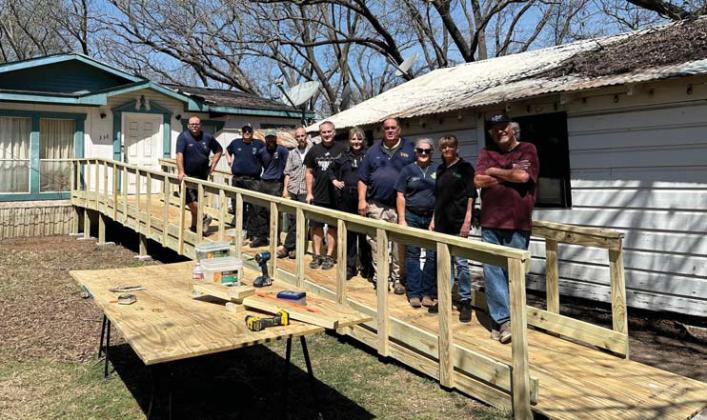 A finished wheelchair ramp will now help a resident with mobility difficulties. Volunteers with Dublin EMS, city of Dublin, Dublin PD and Revitalize Dublin assisted with the project. Courtesy photo