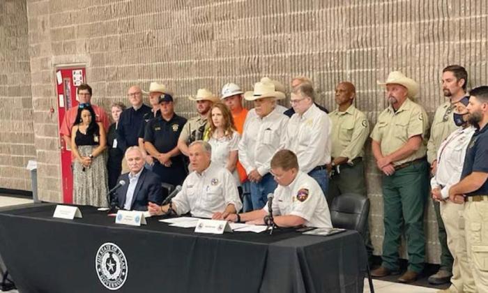 Abbott visits area for fire declaration