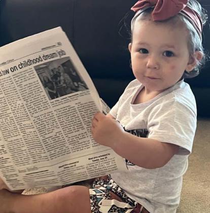 Cypress Jennings Allen, 16 months, learns its never too early to become a newspaper reader. Her parents are Heath and Leah Allen. Sheran Weibel | Submitted photo