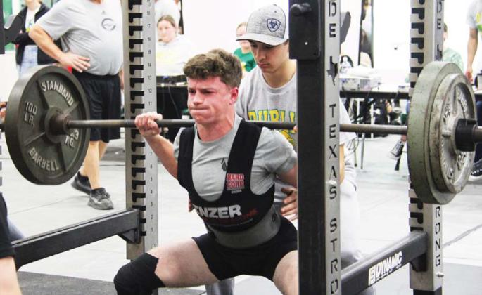 Dublin Lion Cameron Patton (above) works to raise the bar in a squat at Saturday’s Dublin Invitational Powerlifting Meet. Patton claimed a second place finish while Mariana Ortiz claimed a bronze in her class. Wyndi Veigel | Citizen staff photos