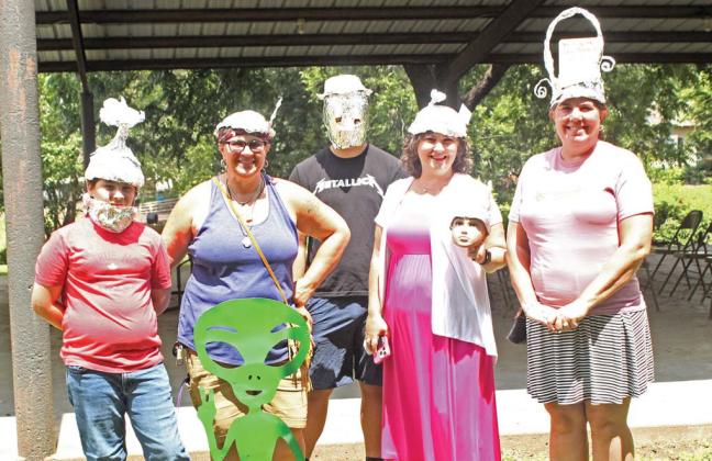 Winners of the tinfoil hat contest show off their best signal-blocking styles during an event in honor of the 133rd anniversary of a reported UFO explosion over the William T. Miller Grist Mill. The event was held Saturday, June 15 alongside the monthly Dublin Market Day farmers market in Wright Park. Orion Gallagher | Citizen staff photo