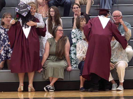 Lingleville High School Valedictorian Giselle Azua Medina and Salutatorian Zaidan Bennett give roses to teachers and administration who made an impact on them in high school. Wyndi Veigel-Gaudette | Citizen staff photo