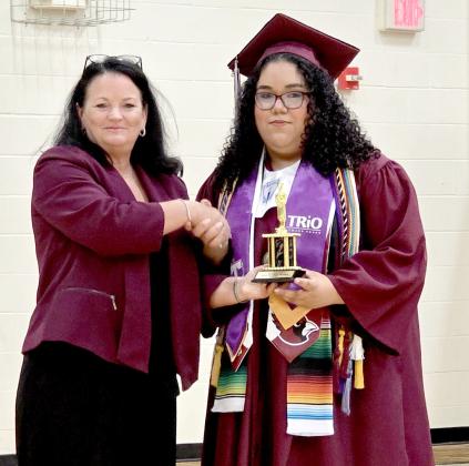 Giselle Azua Medina, Valedictorian for the Class of 2026 for Lingleville High School, is presented an award for being top of the class by Superintendent DeeCee McDougal. Giselle will receive her freshman year paid for at any Texas college or university. Wyndi Veigel-Gaudette | Citizen staff photo
