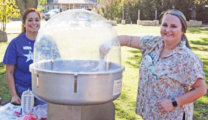 Star Council members make cotton candy at the Dublin Library Card Sign Up social Monday, Sept. 26 at the Dublin Public Library. Below, kids play games at the event. Paul Gaudette | Citizen staff photos