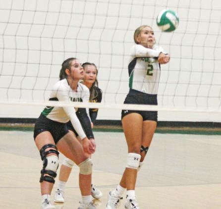 Dublin Lady Lion Bailey Watson returns the ball in an Aug. 8 home game against Hamilton while teammates Madison Turley and Paige Wilson move in to assist if needed. Paul Gaudette | Citizen staff photo