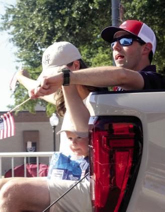 Parade participants concentrate on flinging candy. Wyndi Veigel-Gaudette | Citizen staff photo
