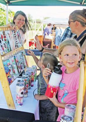 Susan Keith sells handmade tumblers at the Sip ‘N Shop organized by the Dublin Chamber of Commerce and Lucky Vines on Saturday, June 10. For more photos of these events see the Dublin Citizen Facebook page. Wyndi Veigel | Citizen staff photo