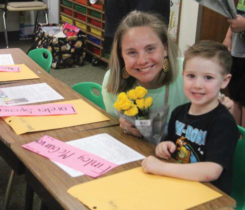 Wyndi Veigel | Citizen staff photo Finley brings his pre-K teacher Ms. Kaylyn Burrow flowers for Meet the Teacher night Aug. 8. Kaylyn is a first year teacher and extremely excited for the first day of school.