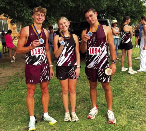 Lingleville High School Cross Country Runners Garrett Hurt, Bailyn Vann and Jacob Koke brought home hardware from Huckabay after medaling in Aug. 25 events. Hurt took first place in the boys 3-mile with a time of 17:46. Vann took second in the girls 2-mile with a time of 14:17. Koke took second with a time of 18:23. | submitted photo