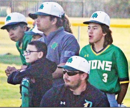 Paul Gaudette I Citizen staff photos Dublin High School senior Chris Teten (above, center) supports the Dublin Lions from the dugout and helps lead stretches (left) before a recent home game. Teten was cleared from the injury list Tuesday, April 4 after nearly eight months of recovery.