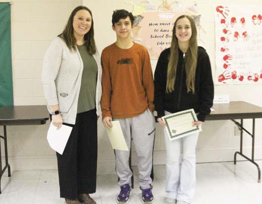 Circle of Champions Eli Moreno, Enrique Perez (not present), Regan Vanbebber and Kloie Whiteley (not present). Presented by Principal Paige Johnson.