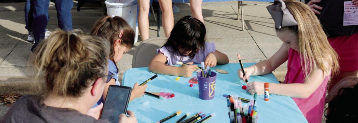 Kids of all ages enjoy creating an ice cream cone craft with Cross Timbers Fine Arts Council. Left below, State Rep. Shelby Slawson and her daughter enjoy the event along with other ice cream lovers. David Swearingen | Citizen staff photos