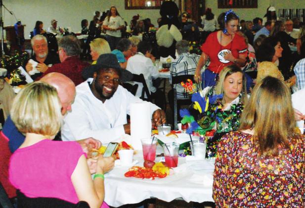 More than 200 flocked to the return of the annual Ragin’ Cajun fundraiser for the Cross Timbers Fine Arts Council, which featured a crawfish and shrimp boil, live zydeco music, silent auctions and a host of helpful volunteers and local celebrity waiters. See more photos of the event on Page A8. Paul Gaudette | Citizen staff photo
