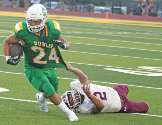 Dublin Lion Jovani Cervantes gets his jersey stretched by a DeLeon Bearcat during the season opener on Cervetto Field Friday, Aug. 30. Paul Gaudette | Citizen staff photo