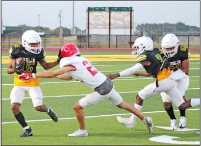 Dublin JV Lion Ronaldo Bahena works to push past an advancing Albany Lion during their home game Thursday, Aug. 31. The home team fell 38-0 in the hardfought game. Paul Gaudette | Citizen staff photo
