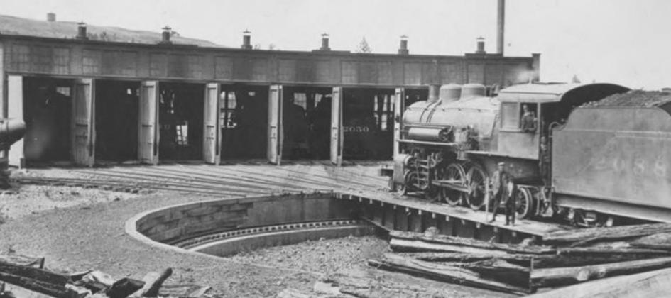 This picture is of the railroad shops in Malden, Washington in 1910. The shops we had here in Dublin must have looked much like this. Our roundhouse must have been made of wood, since carpenters arrived here and tore it down in a matter of days. Though the roundhouse was removed, the turntable stayed until 1954. Whitman County Library | Public Domain photo