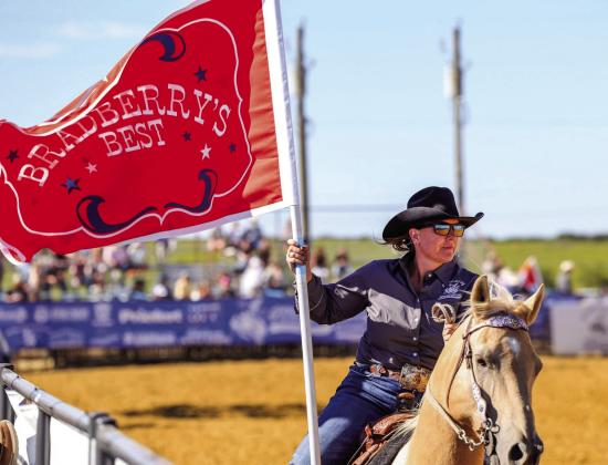 Terah Bradberry waves the banner for Bradberry's Best at a previous CCPRCA event. | submitted photo