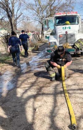 DVFD members mop up after an early morning fire. Courtesy photo