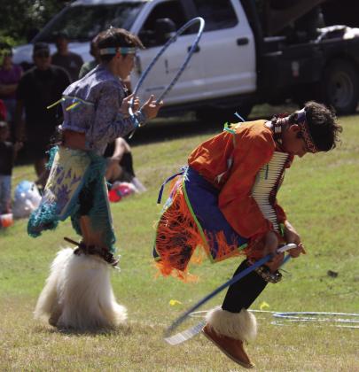 A child from Dublin has his photo made with a group of Native American Exhibition Dancers at Comanche’s Pow Wow Saturday, Sept. 27. The annual event brought thousands to town to enjoy traditions, vendors, entertainment and more. Wyndi Veigel-Gaudette | Citizen staff photo