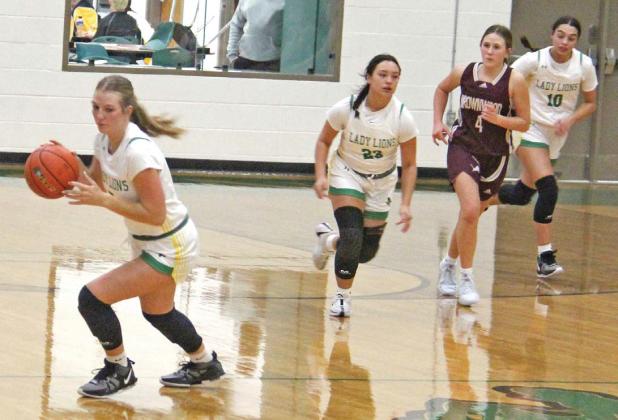 Dublin Lady Lion Derby Kukla pivots to bring the ball back to the net as teammates Haden Keilers and Olivia Salyer rush in from behind. Paul Gaudette | Citizen staff photo