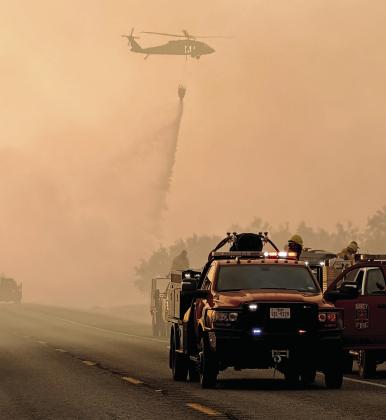 Fire crews from all over Erath County and Texas work to get containment lines established on the Ross Fire, now in its second week in Palo Pinto and Jack Counties. On Tuesday, the fire was at an estimated 90,000 acres with 31% containment. Submitted photo