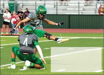 Danielle Meador | Special to the Citizen Aidan Hernandez kicks a field goal as Aiden Saleyer holds the ball. Sev Ruiz (below) is met by Anson Tiger defense as he leaps to receive a pass in Friday night’s homecoming game.