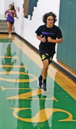 Dublin cross country runners moved their first day of practice indoors Monday, Aug. 4 due to some stormy weather, resulting in some ‘hilly’ terrain as they ran up and down the stands and around the court before coaches Wes Grisham and Jamel Anderson led them through a variety of exercises on the gym floor. The runners will travel to Brock Aug. 15 for their first meet. Paul Gaudette | Citizen staff photo