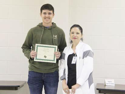 Academic Scholars Caden Vanbebber and Morgan Keith (not present). Presented by DHS Principal Norma Briseno.