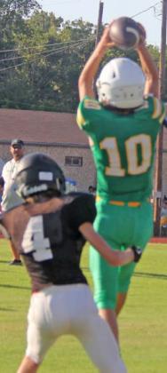 A JV Lion pops up to catch a pass around Hamilton defense in the Aug. 16 scrimmage. Paul Gaudette | Citizen staff photo