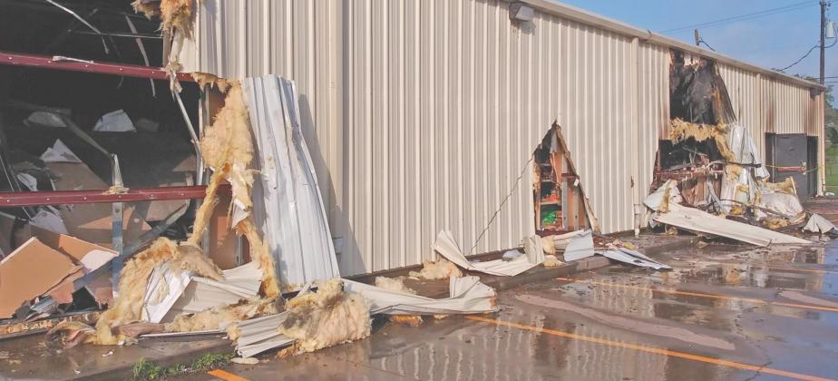Holes were cut into the side of the Dollar General building to allow crews better access in fighting the June 8 fire. Paul Gaudette | Citizen staff photo