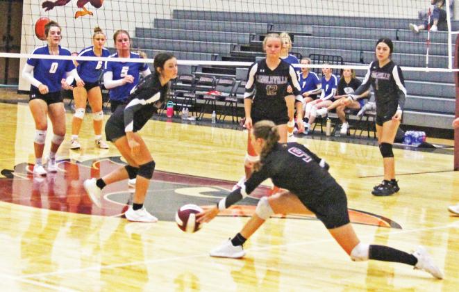 Cambri Coburn swoops under to return a ball to Lipan opponents during the Aug. 27 home game. Both sides brought intensity, resulting in a five-set loss to the visitors. Paul Gaudette | Citizen staff photo