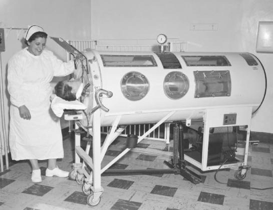 Many people were made sick or crippled by Infantile Paralysis or Polio. The paralysis was caused by the disease attacking the nervous system. For some, the nerves that controlled breathing were damaged. Those patients were placed in an iron lung to help them breath until they were able to recover from the disease.. | Public Domain photo