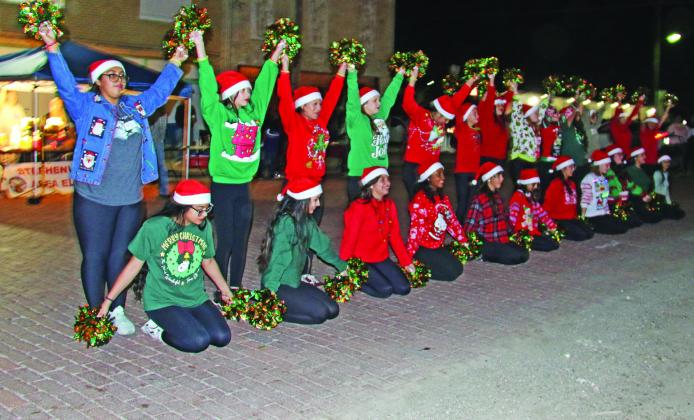 The Dublin Junior High Dance Team performs on Elm Street during the annual Cowboy Christmas festivities. Paul Gaudette | Citizen staff photo