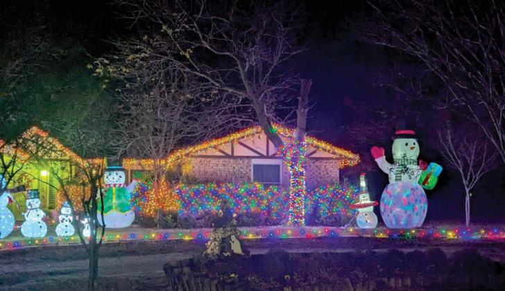 1107 Thomas was chosen as the Sponsor’s Choice award winner. The home features a split yard filled with inflatable snowmen on the other half and multi-colored lights and snowmen on this half. Wyndi Veigel-Gaudette | Citizen staff photo