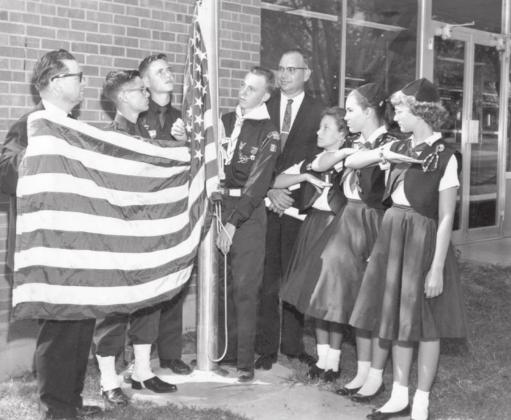 The new $100,000 post office was finished in July 1961. The dedication ceremony took place on September 9, 1961 with a flag raising performed by the Boy Scouts and Campfire girls with postmaster Bill Cowan (right) and post office representative Frank Etheridge (left) looking on. The building has proudly served the Dublin community for almost 60 years. Paul Gaudette | Citizen staff photo