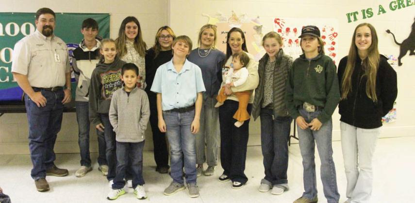 Stock Show 11 students made sale at the Erath County Junior Livestock show. They include: Tatum Babkowski, Laney Benfer, Jitse DeBoer, Kyler Ivie, Riley Kemp, Anabel Phelps, Shiloh Ramsey, Kenli Roberson, Jena Sorrells, Mikayla Taff and Frida Villicana. Not all students were present for the photo. Presenting the award was FFA Sponsors Derek Dunlap and Sophie Hayhurst.