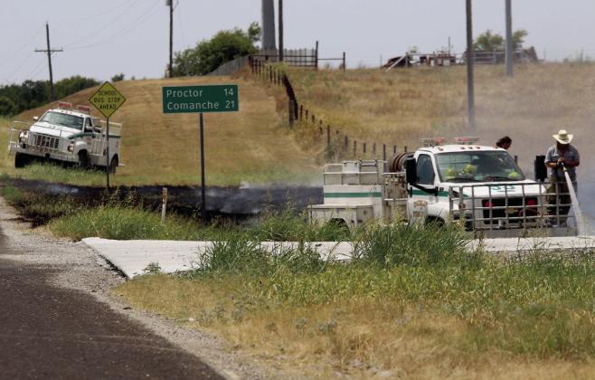 Dublin VFD extinguishes a small grass fire on South Patrick Street Sunday, Aug. 23. Departments have been battling fires for several weeks due to dry conditions and heat. Wyndi Veigel-Gaudette | Citizen staff photo
