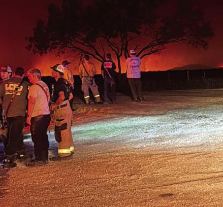 Crews overnight on Monday survey the scene at the Ross Fire in Palo Pinto County awaiting assignments. Submitted photo