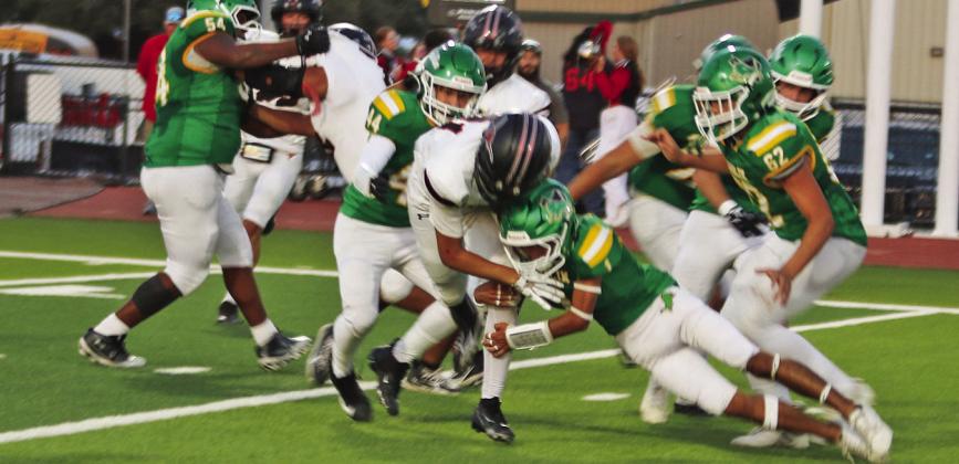Dublin Lions Kyler Gaitan and Kyler Ivie wrap up a Maverick runner Friday, Sept. 18. Paul Gaudette | Citizen staff photo