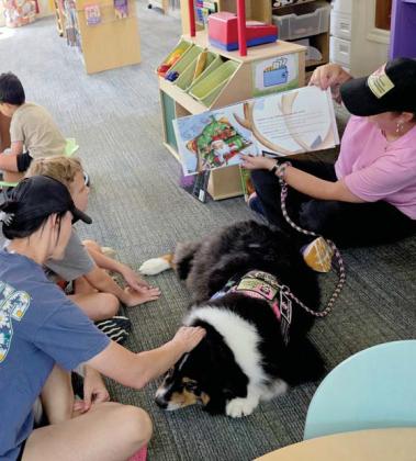 Lyndi Hannah and Annie from Annie’s Therapeutic Companions read to young patrons at the Dublin Public Library Friday, July 18. The dog and handler will return Friday, July 25 at 10 a.m. for Tranquil Tales with Annie, giving kids the chance to hear a story and spend time with a therapy animal. Wyndi Veigel-Gaudette | Citizen staff photo