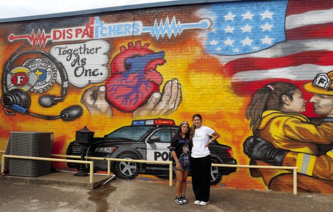 Dublin Junior High art teacher Skye Gaitan stands with Selene Moreno after the student was named the winner of an art contest, which allowed her drawing to become a mural. Gaitan encouraged Selene to enter after seeing her talent as an artist. Wyndi Veigel-Gaudette | Citizen staff photo