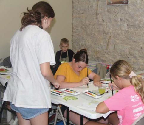 Students learn proper mixing techniques while working on a watercolor painting. Wyndi Veigel-Gaudette | Citizen staff photo